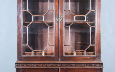 A George III Mahogany Bookcase, the upper part with moulded...