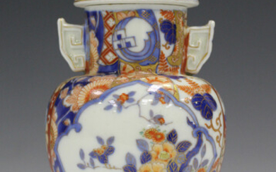 A Japanese Fukagawa Imari porcelain vase and cover, Meiji period, painted with panels of flowers, un
