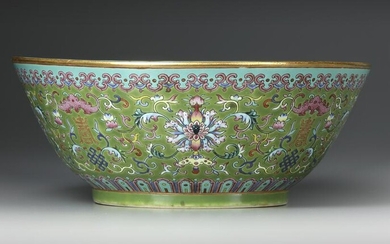 A LARGE FAMILLE ROSE GREEN-GROUND BOWL