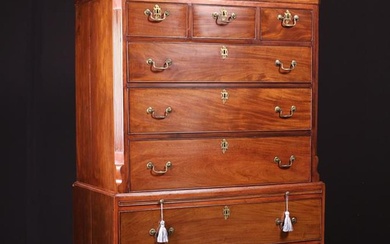 A Large George III Mahogany Tallboy. The upper section having a moulded top with canted corners abov