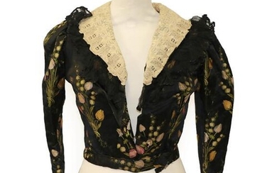 A Late 19th Century Black Silk Brocade Jacket, woven with...