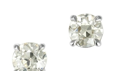 A PAIR OF DIAMOND STUD EARRINGS in 18ct white gold, each set with an old European cut diamond of