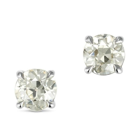 A PAIR OF DIAMOND STUD EARRINGS in 18ct white gold, each set with an old European cut diamond of