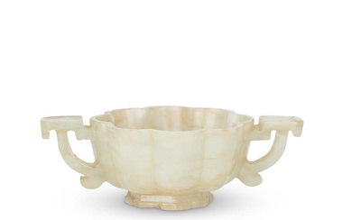 A PALE GREEN AND RUSSET JADE 'FLOWER' BOWL 19th century