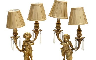 A Pair of French Gilt-Metal Figural Twin-Light Candelabra, in Louis...