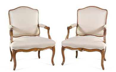 A Pair of Louis XV Carved Beechwood Fauteuils
