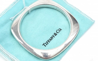 A SILVER BANGLE BY TIFFANY & CO - Of squared design, signed, in sterling silver.