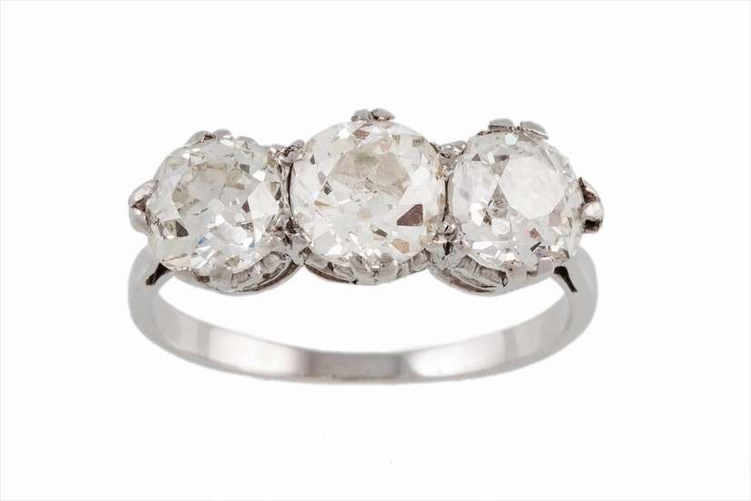 A THREE STONE DIAMOND RING, with old cut diamonds, one diamo...