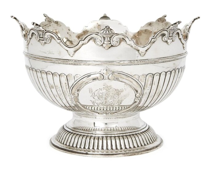 A Victorian silver Monteith punch bowl, Birmingham, 1892, Elkington & Co., raised on a circular foot, the vertically fluted sides with monogrammed cartouche to shaped scrollwork rim, 17.5cm high, 27cm dia., approx. weight 32oz