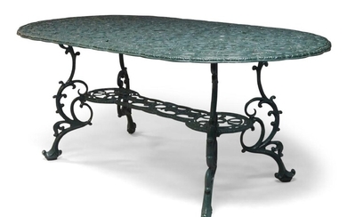 A Victorian style green painted cast aluminium garden table and six chairs, the table top with a foliage cast design, the chairs comprising two carver chairs and four similar side chairs, with foliage cast backs and seats; the table 69cm high...