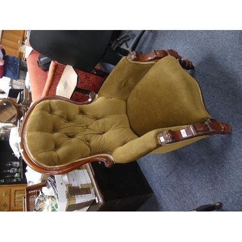 A Victorian walnut framed button back Armchair, with turned ...