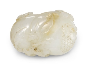 A WHITE AND RUSSET JADE CARVING OF 'POMEGRANATE' GROUP QING DYNASTY, 18TH CENTURY
