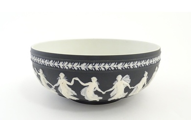 A Wedgwood black Jasperware bowl decorated with Classical ma...