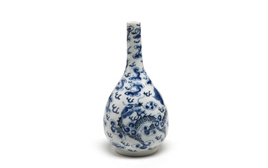 A blue and white porcelain bottle vase painted with dragons writhing amidst clouds