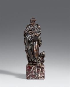 A cast bronze figure of Saint Luke