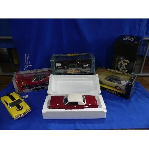 A collection of five 1:18 scale die-cast models, including R...