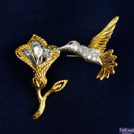 A diamond bird brooch, with tremblant flower.