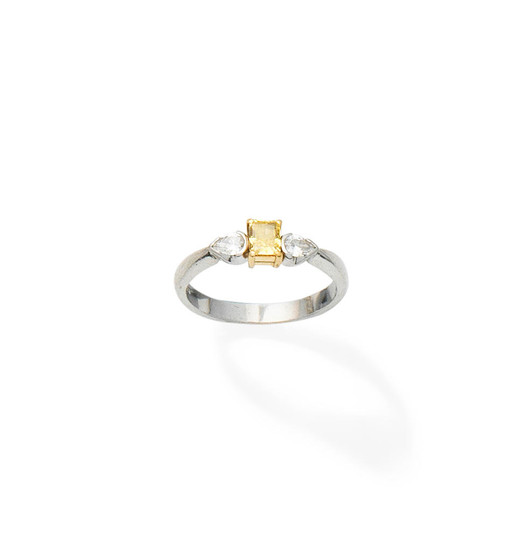 A fancy coloured diamond and diamond three-stone ring