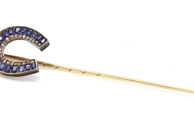 A former Austro-Hungarian sapphire and diamond horseshoe stick pin, attributed to Moritz Henolé