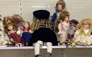 A group of porcelain collectors dolls, tallest H. 60cm.