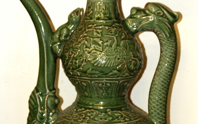 A large Chinese Ming dynasty style crackle celadon glazed wine ewer with dragon handle, H. 62cm.