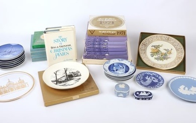 A large assortment of collectors plates