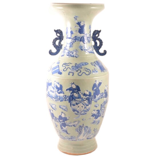 A large floor standing Chinese blue and white vase.