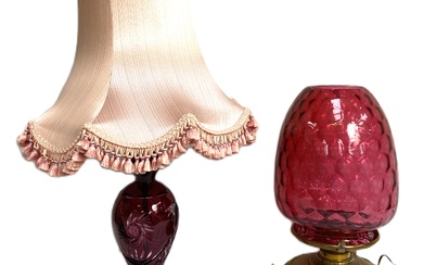 A large late Victorian cranberry glass oil lamp, with a massive ‘honeycomb’ ovoid cranberry shade