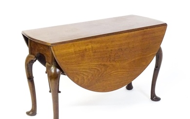 A late 18thC mahogany drop leaf table, opening to form an ov...