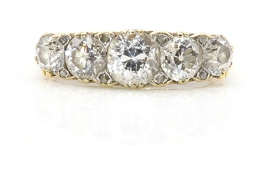 A late Victorian graduated five stone diamond carved head ring