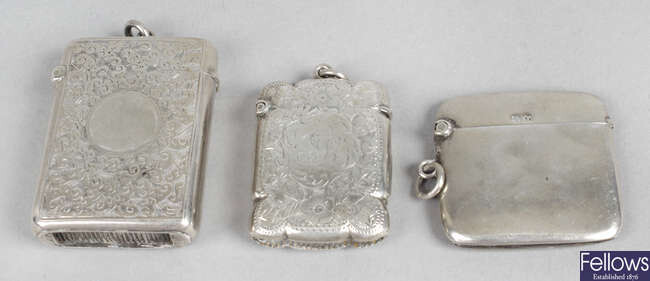 A late Victorian silver vesta case, plus two Edwardian silver examples, two coin holders, etc.