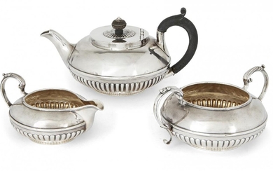 A matched George IV three-piece silver tea set, London, c.1826, (teapot) and London, c. 1839, Richard Sibley II, the set comprising a teapot, sugar and milk jug, each of squat, circular form with half-lobed bodies engraved with lion armorial to one...