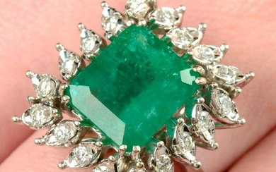 A mid 20th century 18ct gold Brazilian emerald and brilliant-cut diamond cluster ring.Verbal from