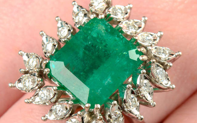 A mid 20th century 18ct gold Brazilian emerald and brilliant-cut diamond cluster ring.