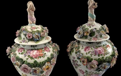 A pair of 19th century Continental floral encrusted and hand...
