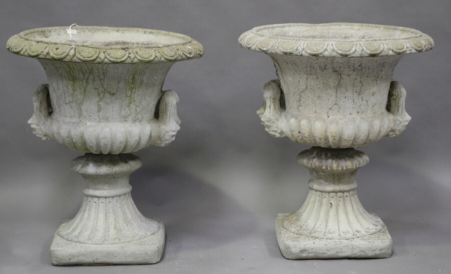 A pair of 20th century cast composition stone garden urns of twin-handled campana form, height 73cm