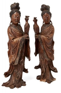 A pair of Chinese carved hardwood figures...