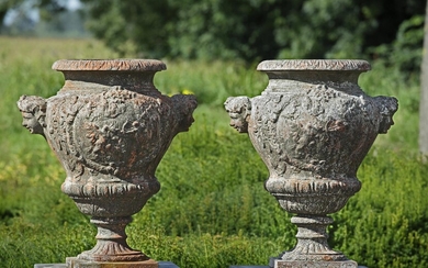 A pair of Continental cast iron garden urns