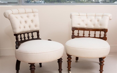 A pair of Edwardian button back nursing chairs, the larger...