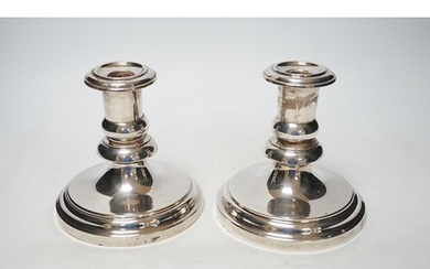 A pair of French Christofle silver plated dwarf candlesticks...