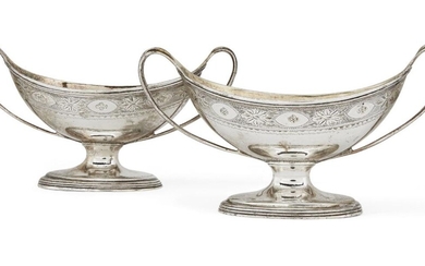 A pair of George III twin-handled silver salts, London, c.1789, Robert Hennell I, of oval form with gilded interiors and bright cut engraved decoration beneath reeded rims, both engraved with matching crest to side, 7.4cm high (to handles), total...
