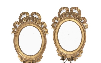 A pair of Gustavian oval giltwood mirrors. Stockholm, late 18th century. H. 64 cm. W. 46 cm. (2)
