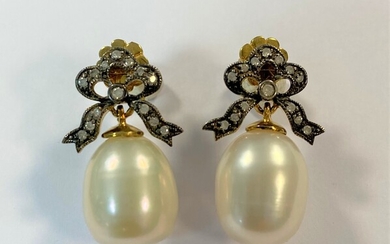 A pair of cultured pearl and diamond bow earpendants