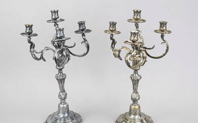 A pair of four-flame table candlesti