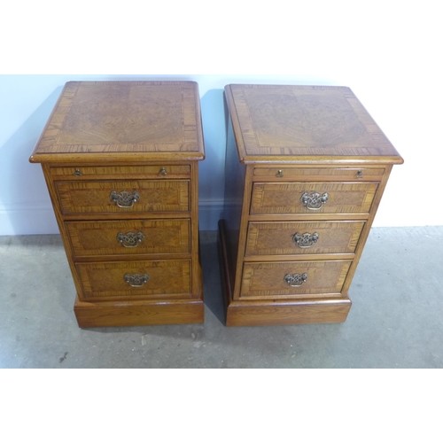 A pair of good quality burr oak three drawer chest with slid...