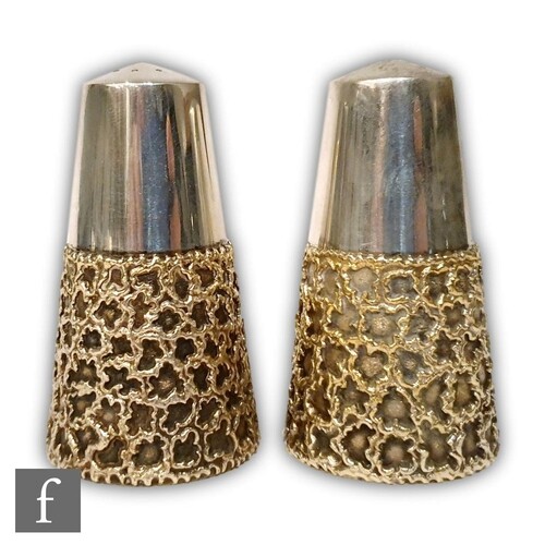 A pair of hallmarked silver salt and pepper pots of tapering...