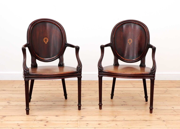 A pair of mahogany hall chairs