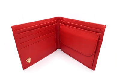 A red leather Rolex wallet - in good condition