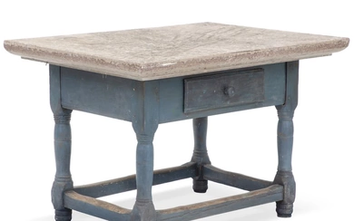 A rural Swedish stone table with an Öland-top and a painted lower...
