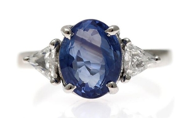 SOLD. A sapphire and diamond ring set with an oval-cut sapphire weighing app. 3.65 ct. flanked by two diamonds, mounted in 14k white gold. Size app. 52. – Bruun Rasmussen Auctioneers of Fine Art